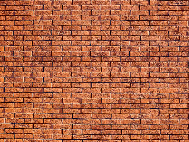 A wall of red clay bricks