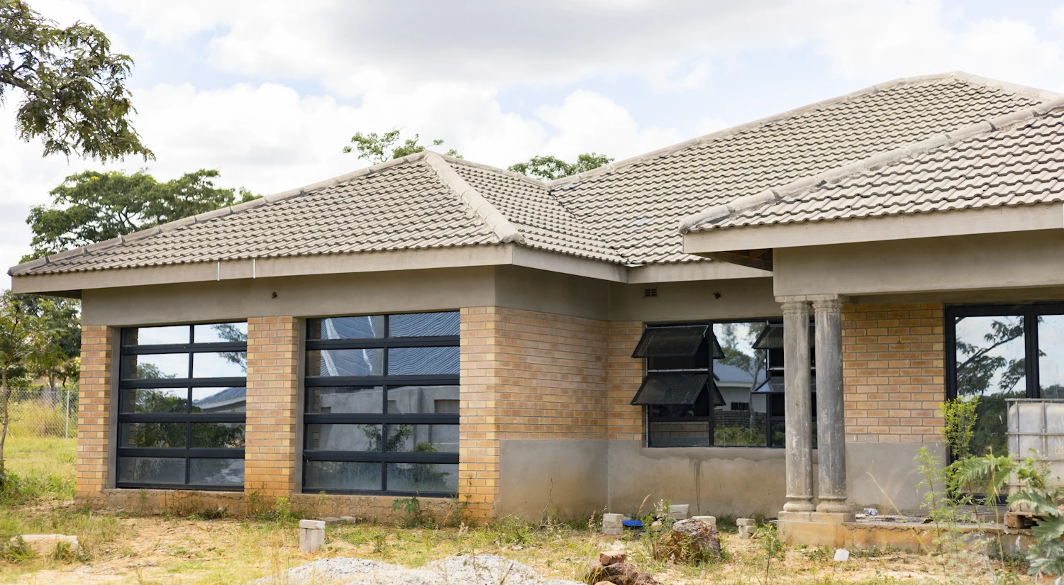 Single-storey brick home with a tiled roof