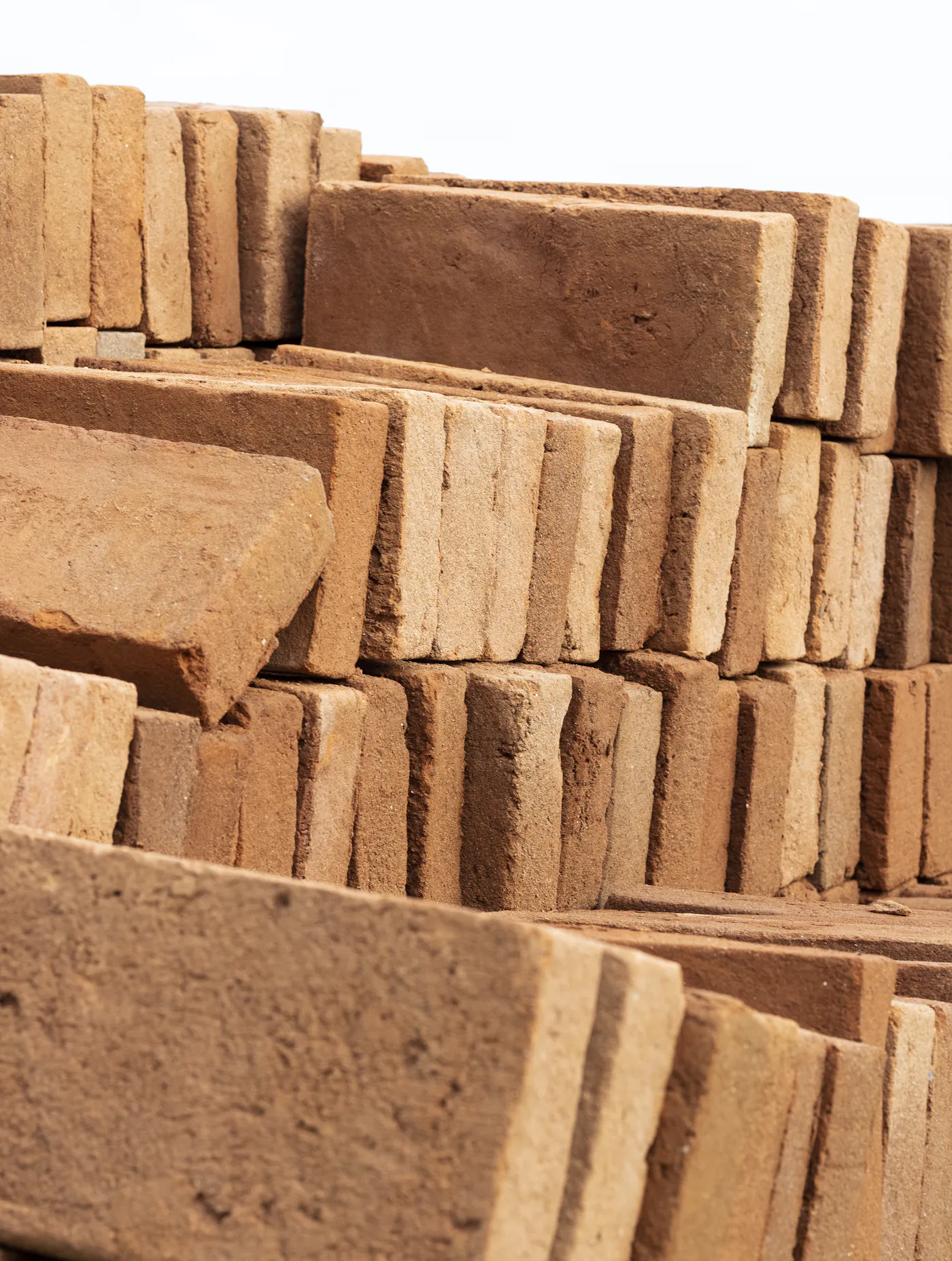 Stacks of earth-coloured bricks