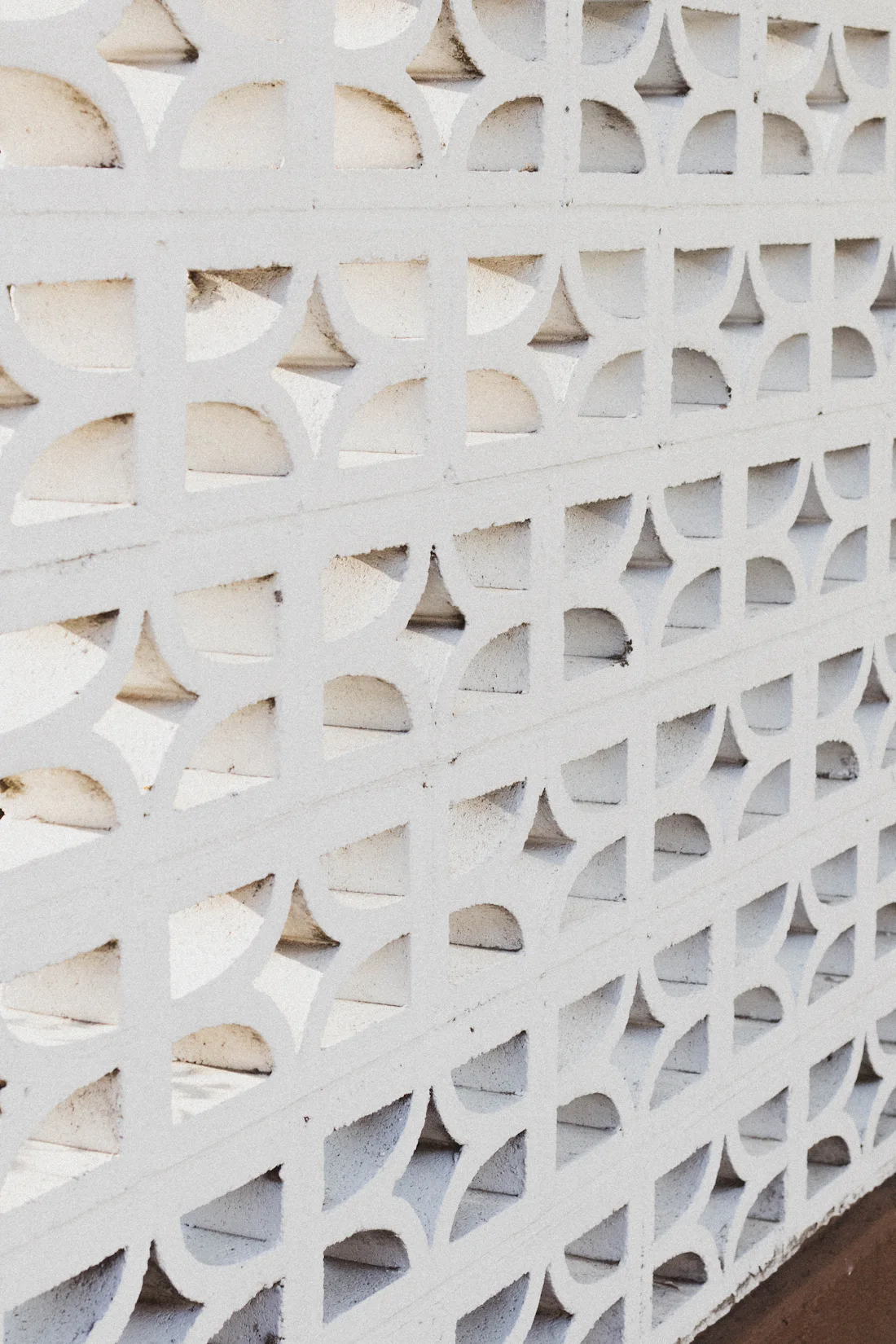 A white wall of patterned decorative blocks